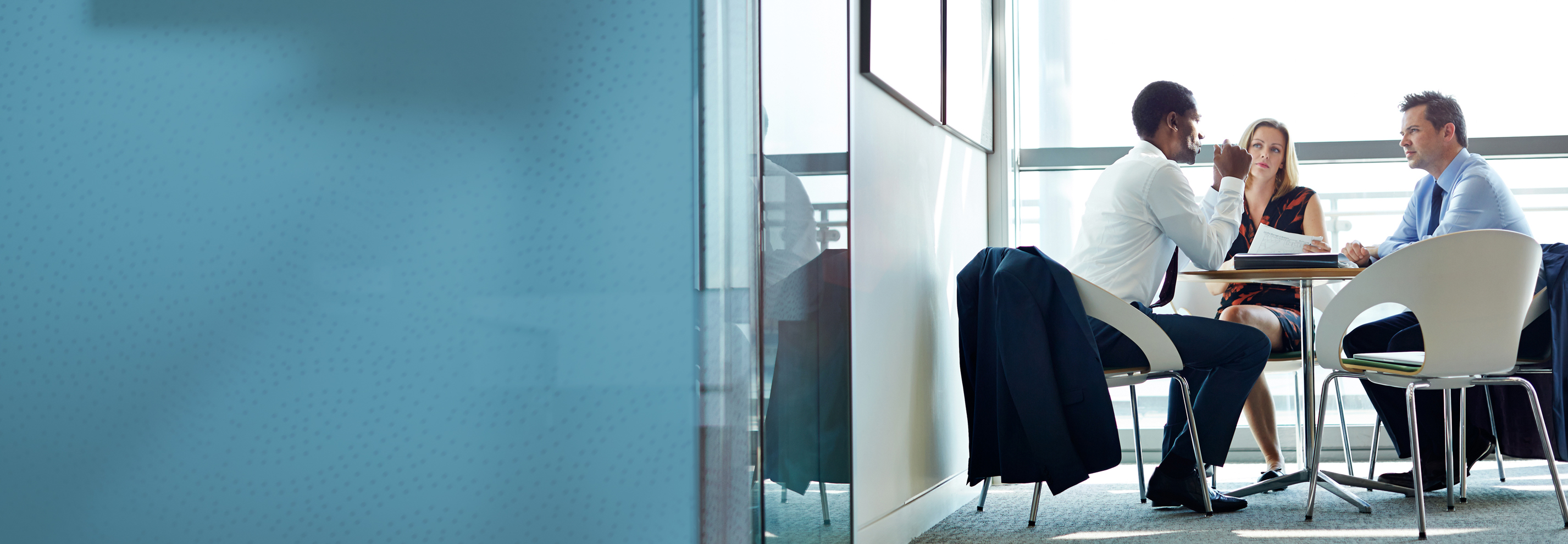 Business people talking in meeting at conference table